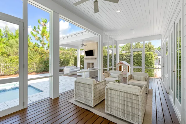 a view of a room with lots of white furniture