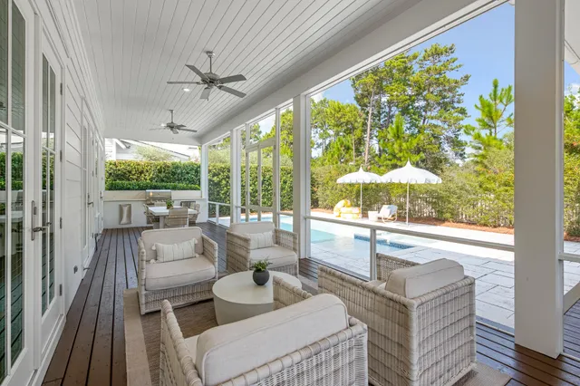 a view of a room with wooden floor and furniture