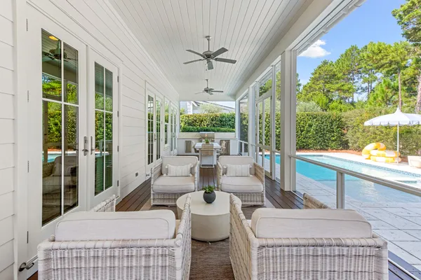 a bathroom with a granite countertop sink a mirror and a shower