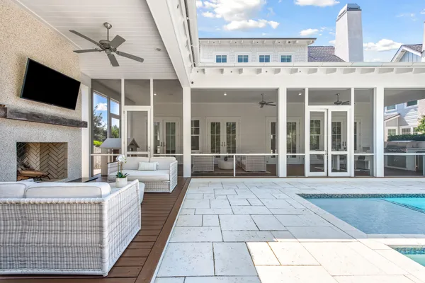 a spacious bedroom with a bed and wooden floor