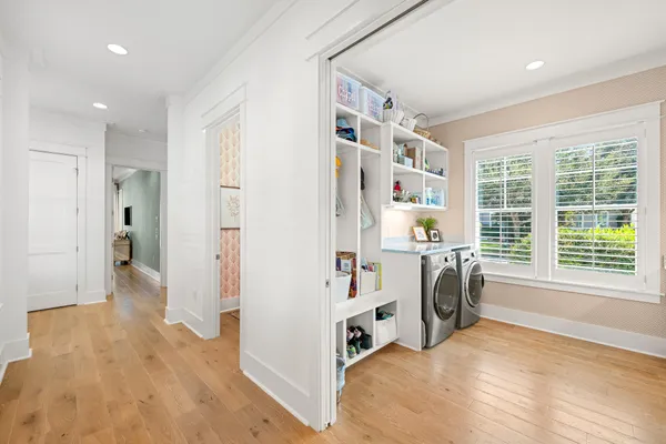 a living room with a flat screen tv and a table