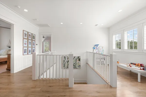 an aerial view of house with yard and lake view