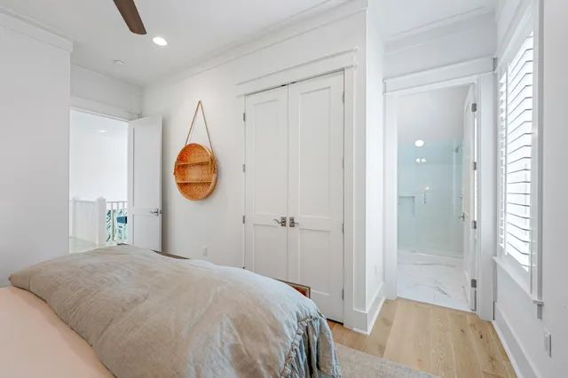 a view of a house with a yard and potted plants