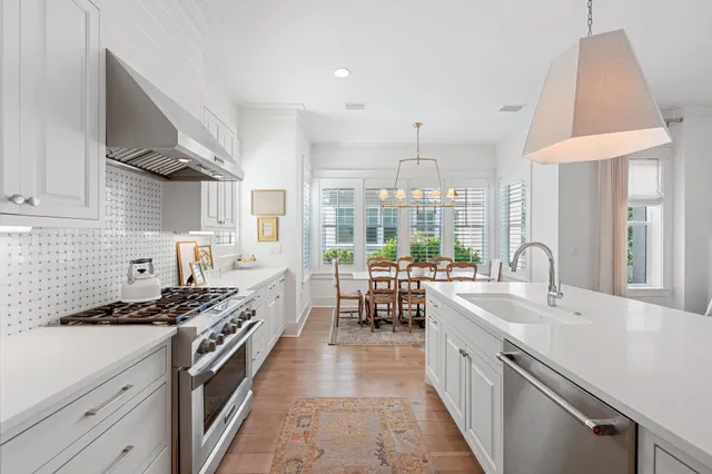a living room with furniture fireplace and a large window