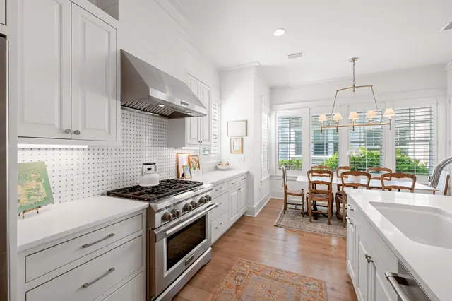 a living room with furniture fireplace and a table