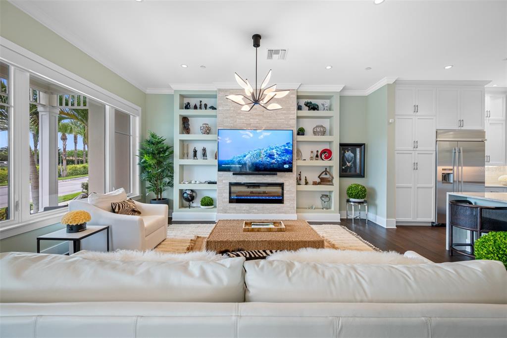 6 Hibiscus Lane Belleair, FL 33756 - Photo 11 of 65 a living room with furniture chandelier and a large window