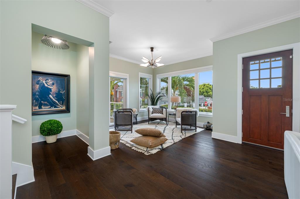 6 Hibiscus Lane Belleair, FL 33756 - Photo 14 of 65 a living room with furniture and a large window