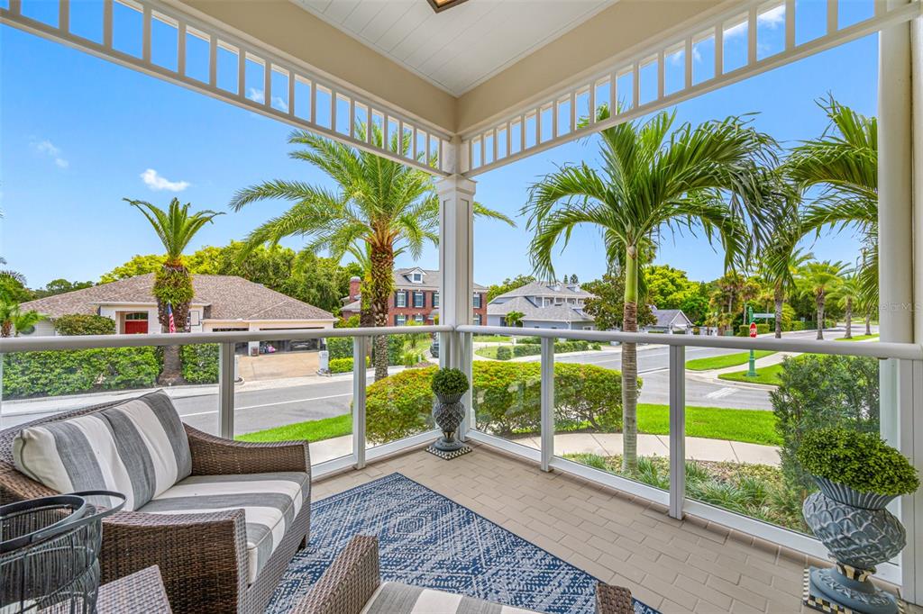 6 Hibiscus Lane Belleair, FL 33756 - Photo 16 of 65 a view of a backyard with swimming pool and porch