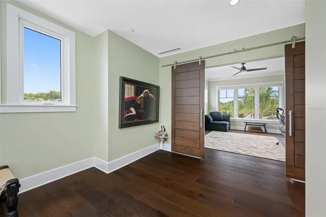 a living room with furniture a window and a chandelier