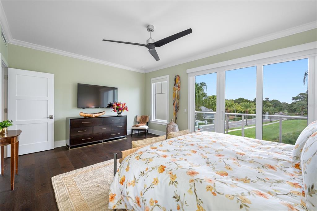 6 Hibiscus Lane Belleair, FL 33756 - Photo 39 of 65 a bedroom with a bed and a flat screen tv