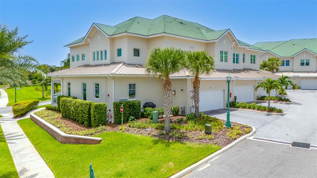 6 Hibiscus Lane Belleair, FL 33756 - Photo 48 of 65 a front view of a house with garden