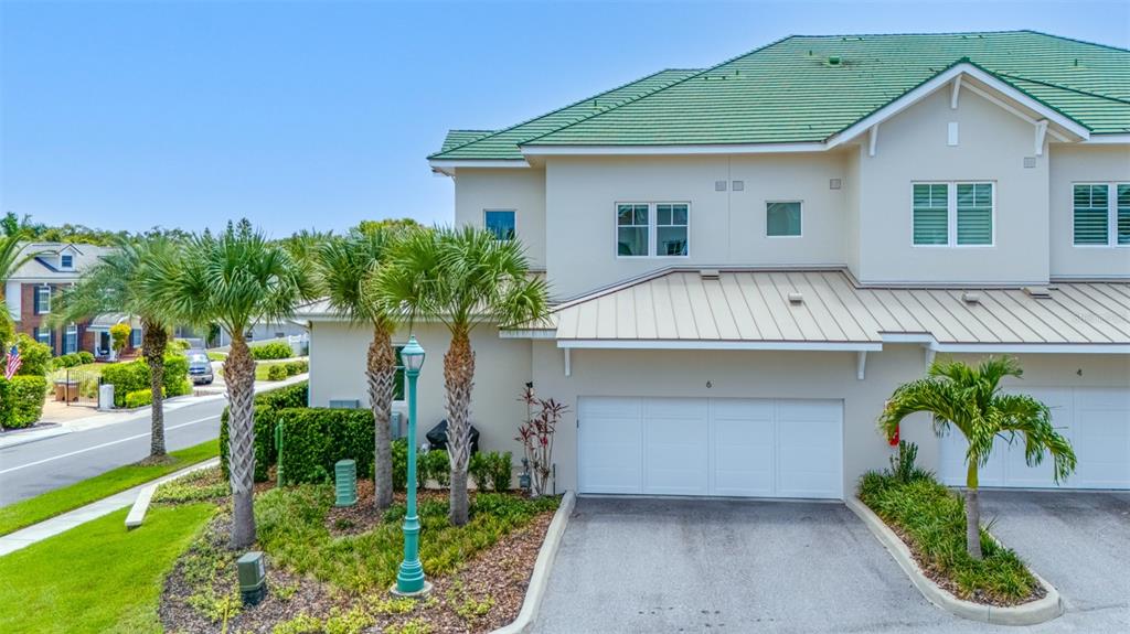 6 Hibiscus Lane Belleair, FL 33756 - Photo 49 of 65 a view of a house with a yard and potted plants