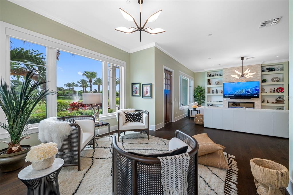 6 Hibiscus Lane Belleair, FL 33756 - Photo 10 of 65 a living room with furniture and a flat screen tv