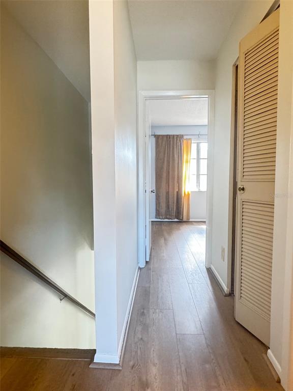 210 Elliot Avenue, Unit 135 Sarasota, FL 34232 - Photo 21 of 26 a view of hallway with wooden floor