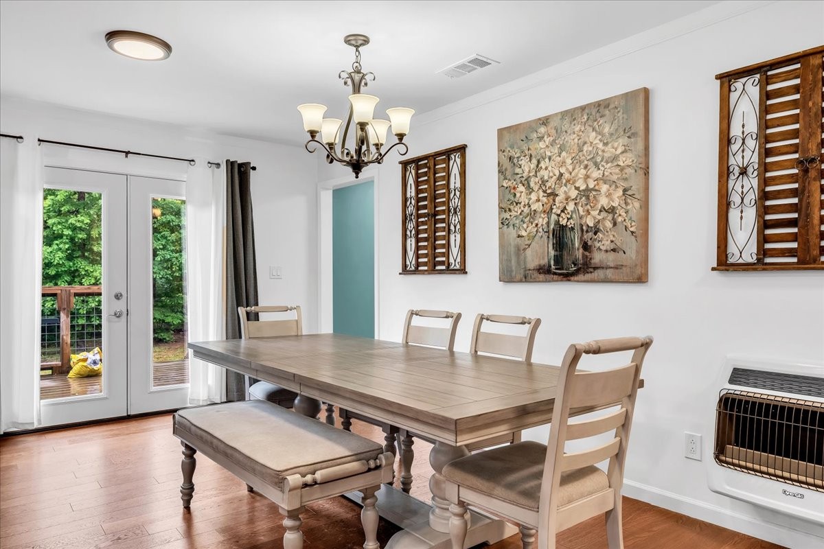 802 Meyers Road Altamont, TN 37301 - Photo 20 of 30 a view of a dining room with furniture wooden floor and chandelier