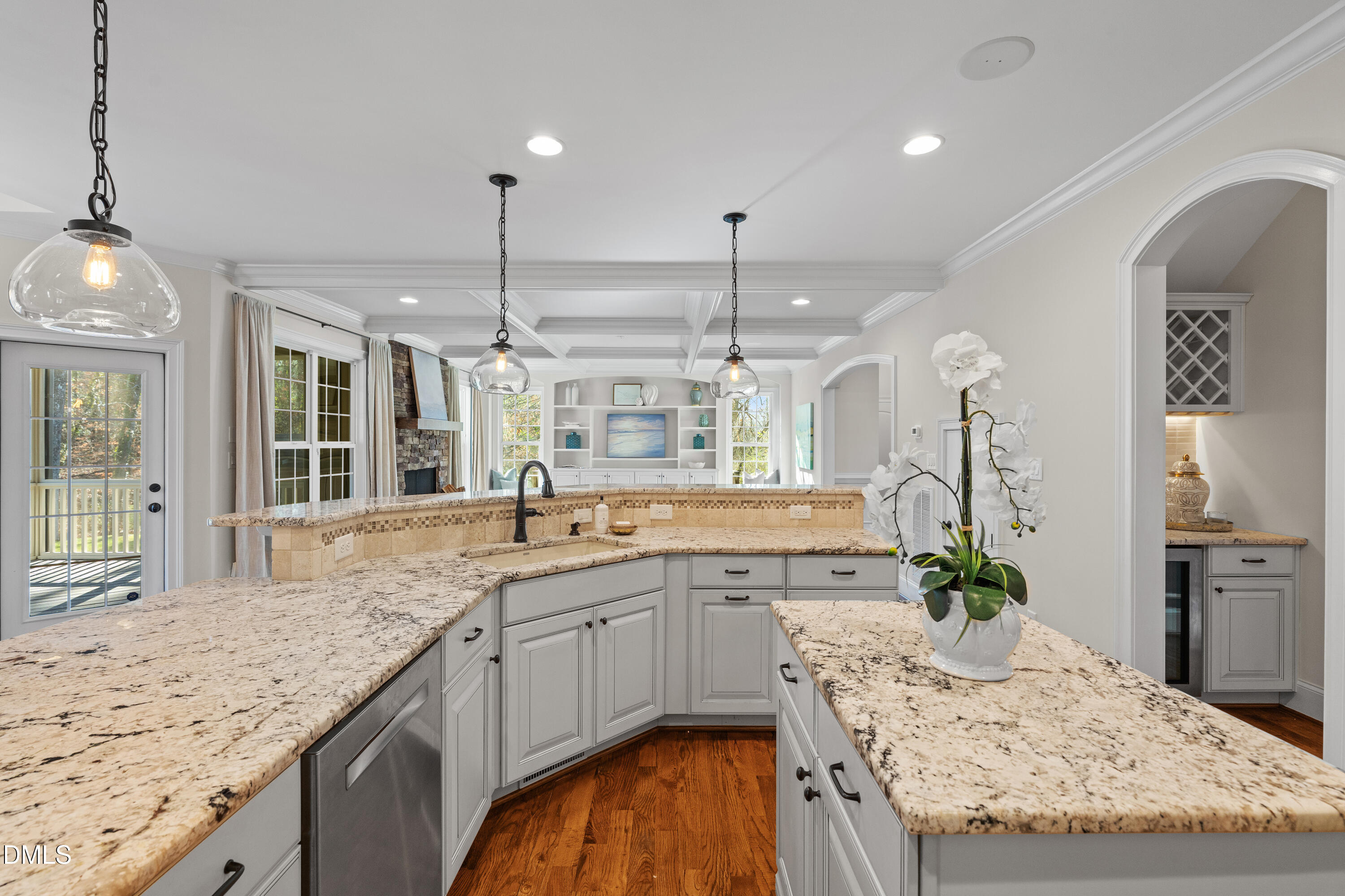 3353 Cheswick Drive Raleigh, NC 27609 - Photo 11 of 53 a kitchen with center island table and chairs in it