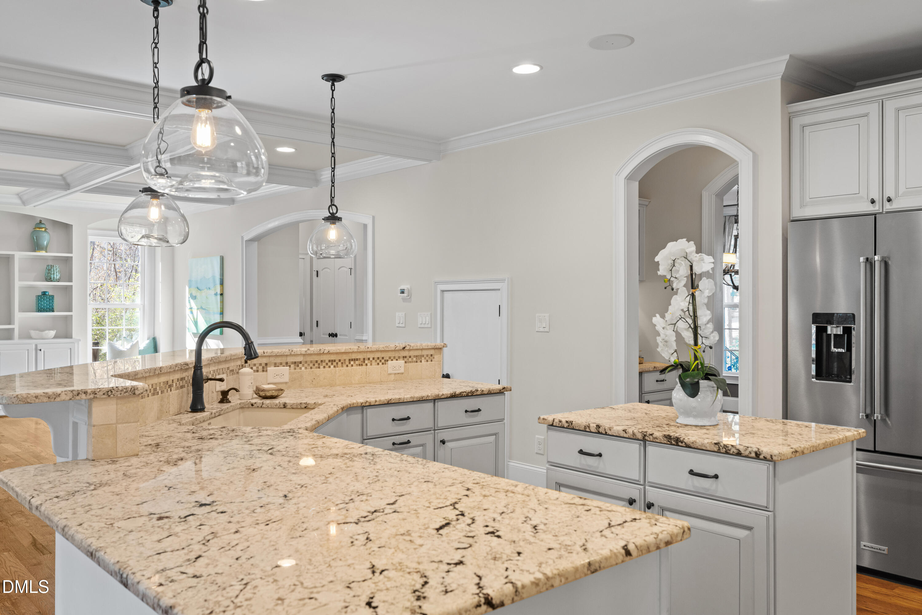 3353 Cheswick Drive Raleigh, NC 27609 - Photo 12 of 53 a large kitchen with kitchen island a sink stainless steel appliances and living room view