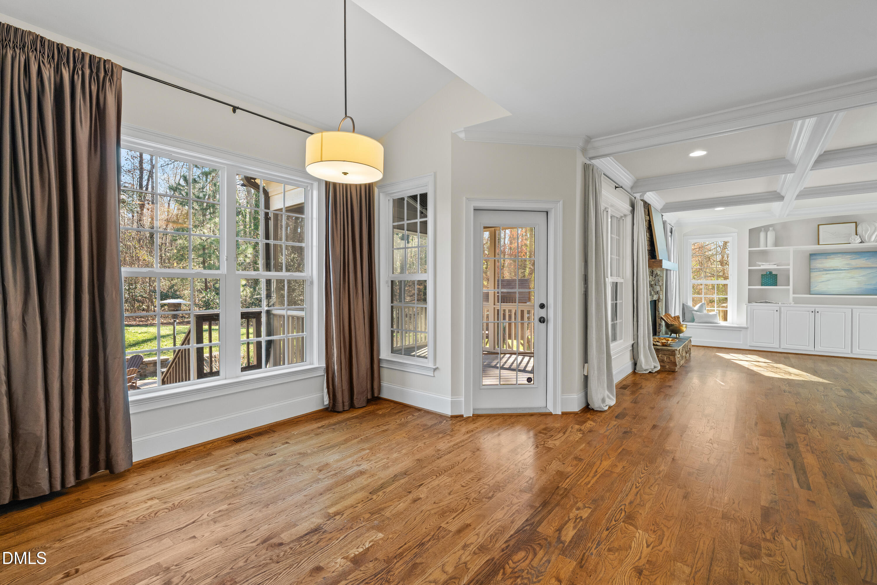 3353 Cheswick Drive Raleigh, NC 27609 - Photo 13 of 53 a view of a room with wooden floor and large windows