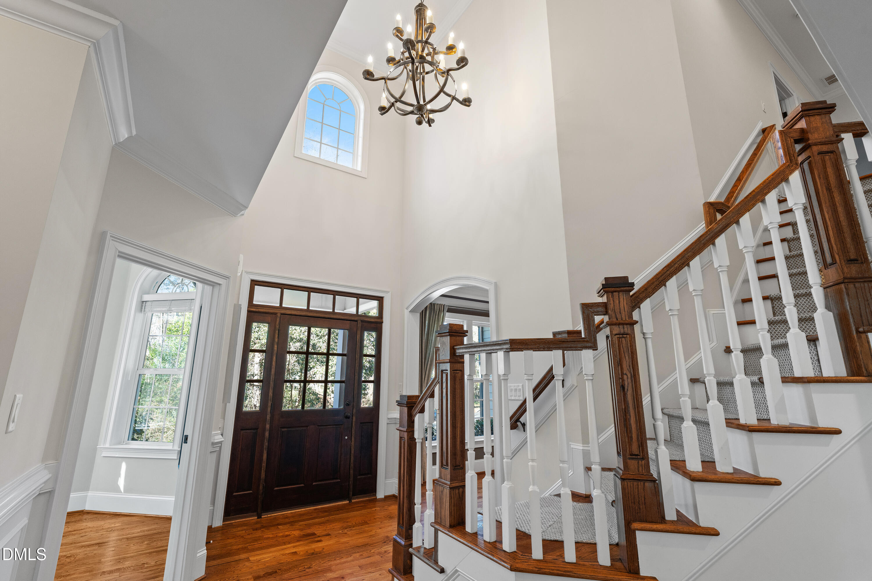 3353 Cheswick Drive Raleigh, NC 27609 - Photo 17 of 53 a view of entryway with wooden floor and stairs