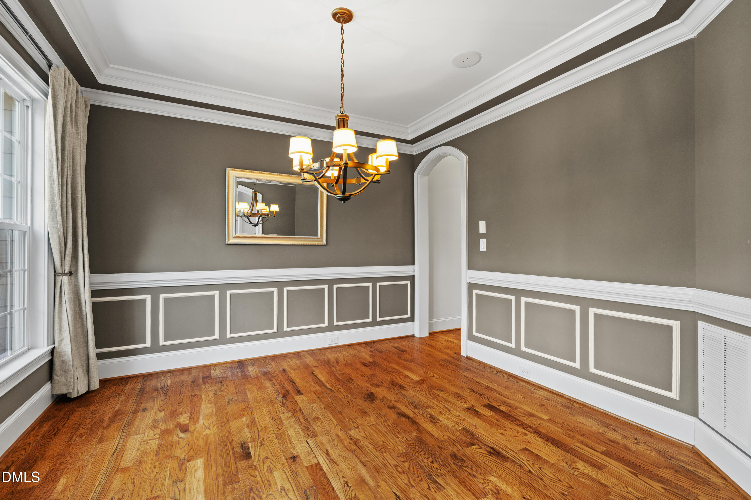 3353 Cheswick Drive Raleigh, NC 27609 - Photo 18 of 53 a view of an empty room with wooden floor and a window