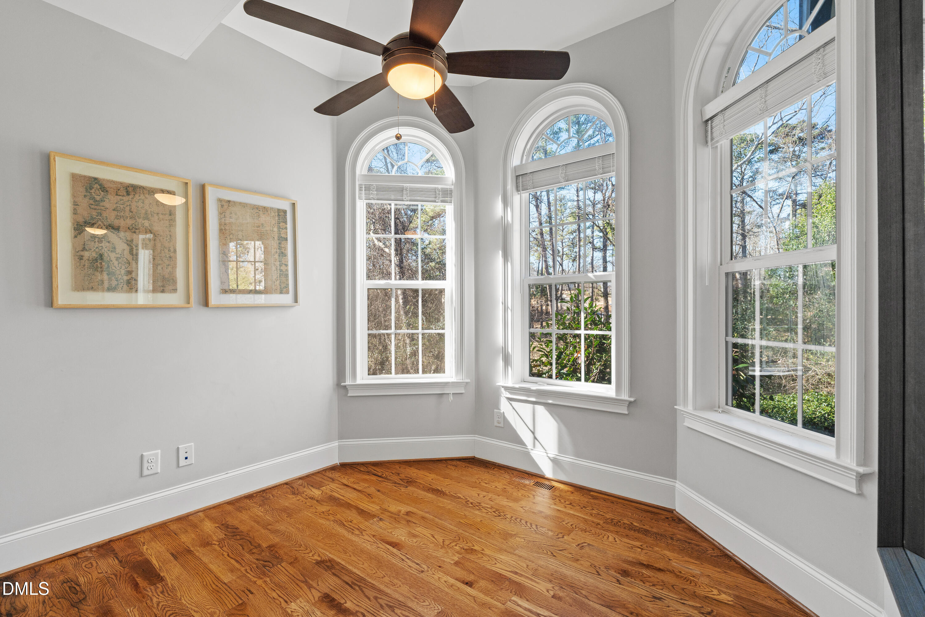 3353 Cheswick Drive Raleigh, NC 27609 - Photo 20 of 53 a view of an empty room with a window and a ceiling fan