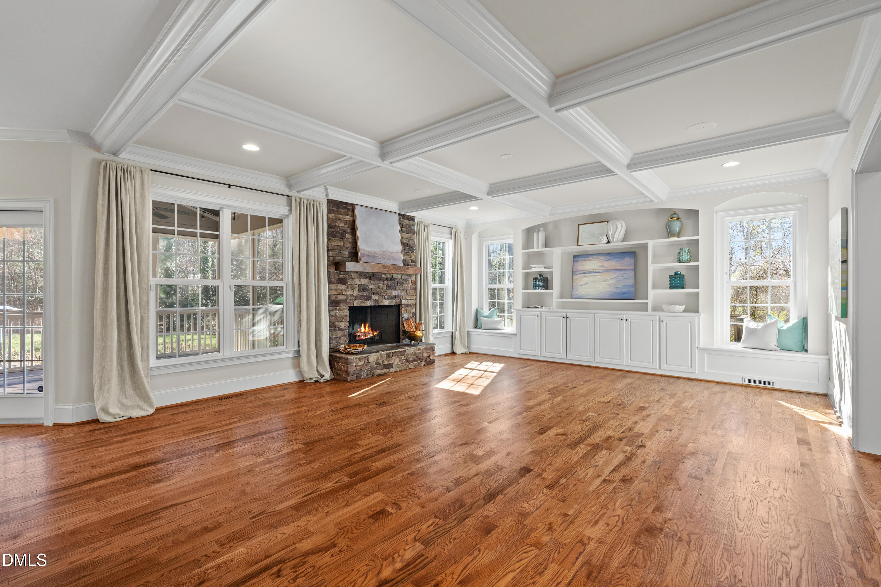 3353 Cheswick Drive Raleigh, NC 27609 - Photo 3 of 53 a view of empty room with wooden floor and fireplace
