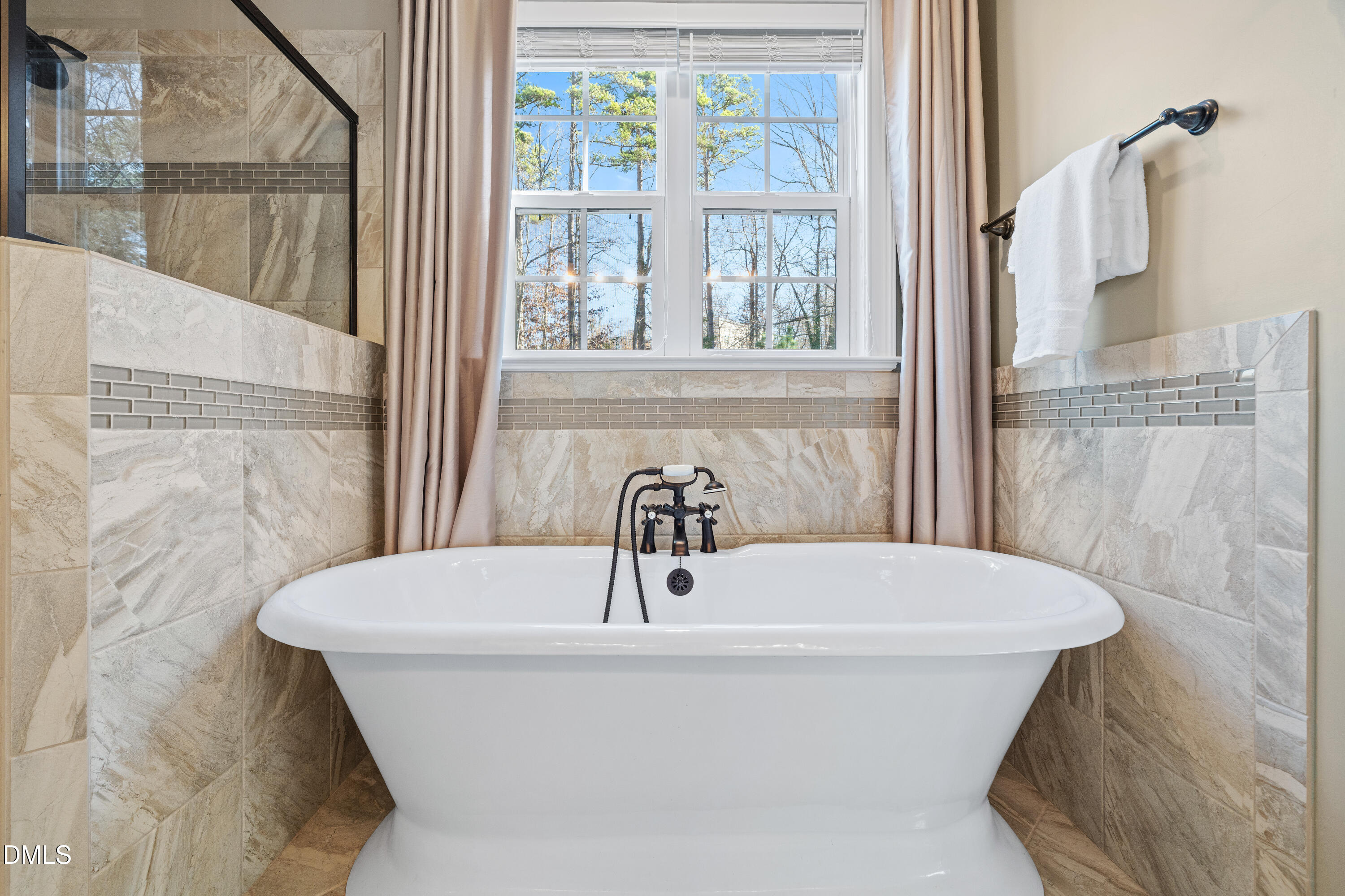 3353 Cheswick Drive Raleigh, NC 27609 - Photo 31 of 53 a bathroom with a bathtub