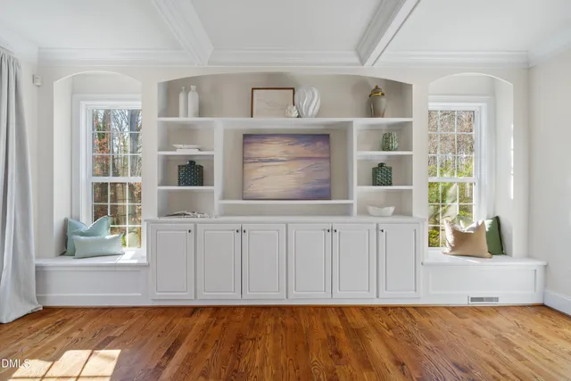 a large kitchen with kitchen island a sink stainless steel appliances and living room view