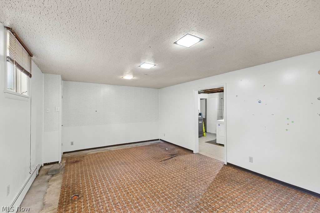 1903 Graham Road Stow, OH 44224 - Photo 22 of 29 Finished room featuring white painted walls and a textured ceiling
