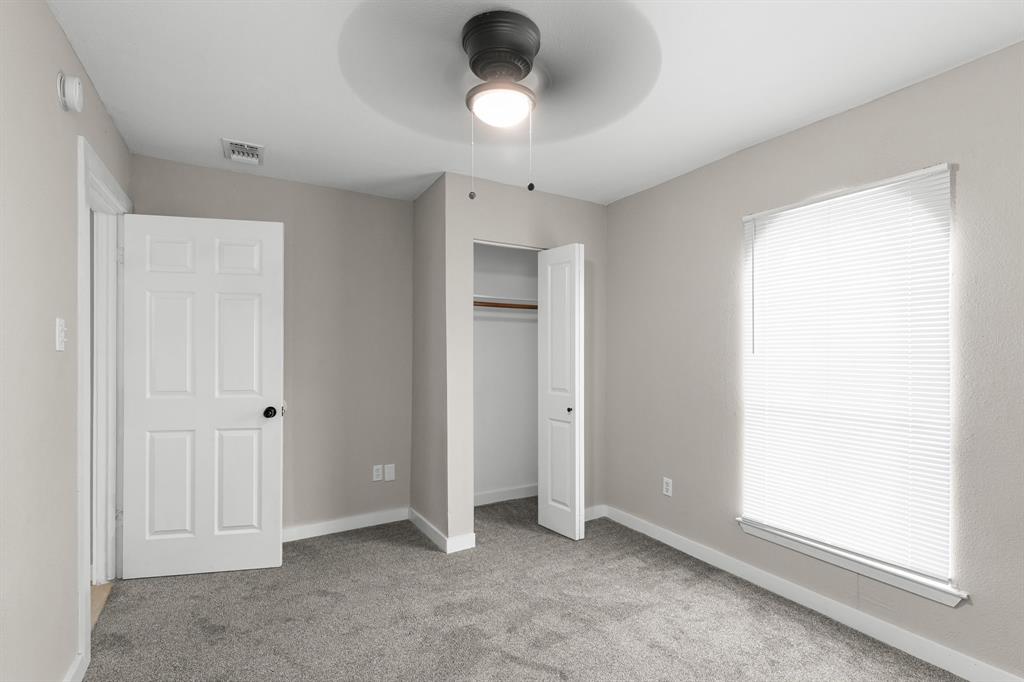 1002 Wembley Road Arlington, TX 76014 - Photo 13 of 20 a view of an empty room with a window