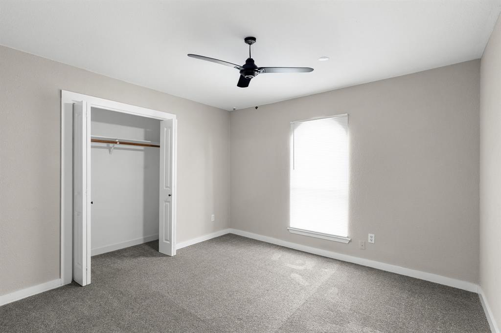 1002 Wembley Road Arlington, TX 76014 - Photo 15 of 20 an empty room with windows and cabinet