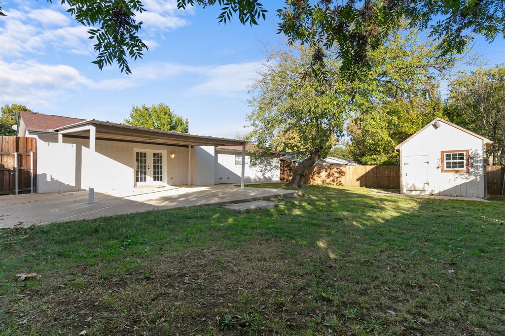 1002 Wembley Road Arlington, TX 76014 - Photo 19 of 20 a view of a house with a yard