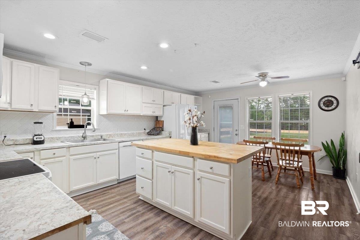6971 March Road Theodore, AL 36582 - Photo 7 of 26 Kitchen featuring crown molding, white appliances, butcher block countertops, a sink, and ceiling fan