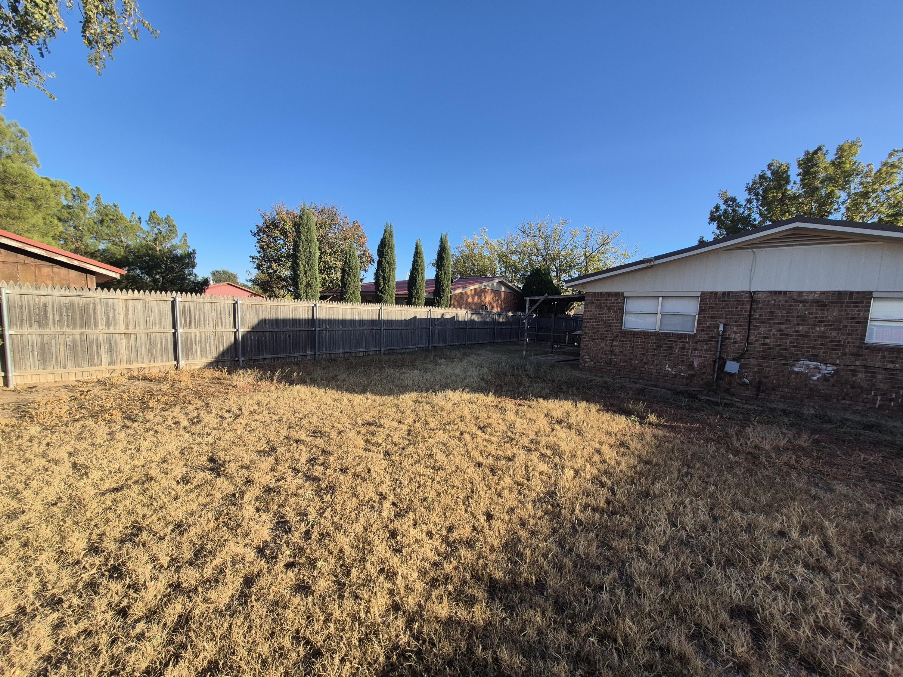 6404 28th Street Lubbock, TX 79407 - Photo 12 of 13 a view of a backyard