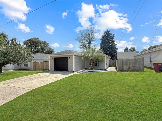 a house view with a garden space