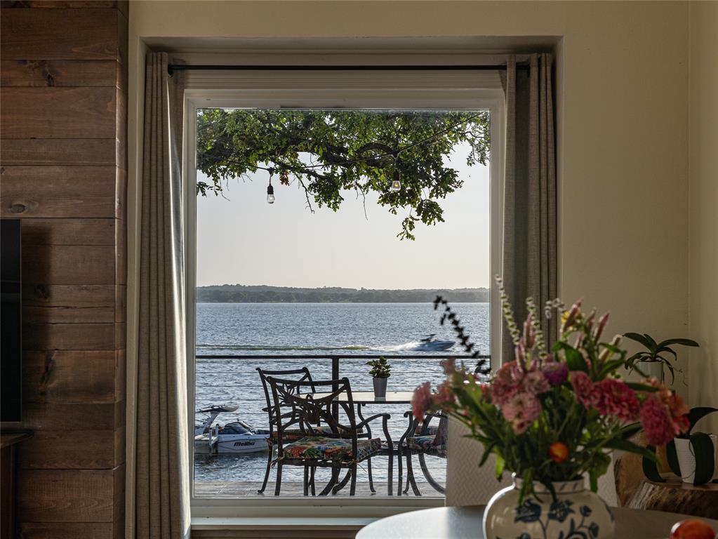 9999 Boat Club Road, Unit 601 Fort Worth, TX 76179 - Photo 6 of 39 A living space framed by the presence of the lake beyond.