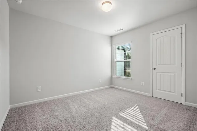 a view of empty room with windows