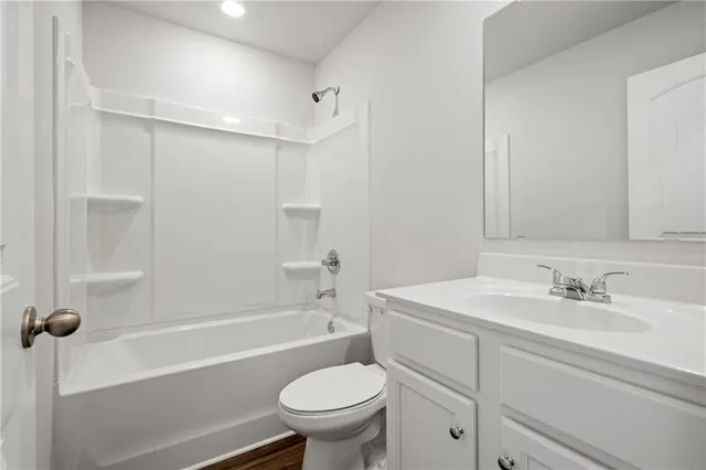 a bathroom with a sink toilet and bathtub