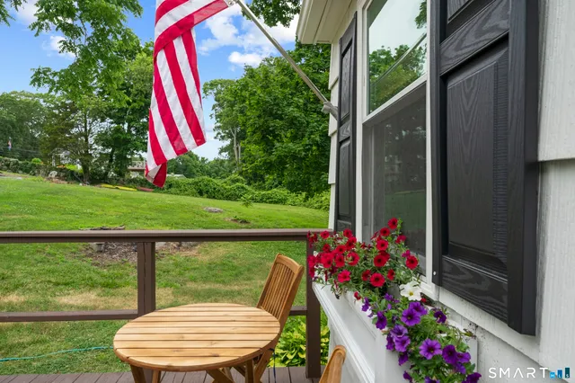 a view of a lake with houses in back