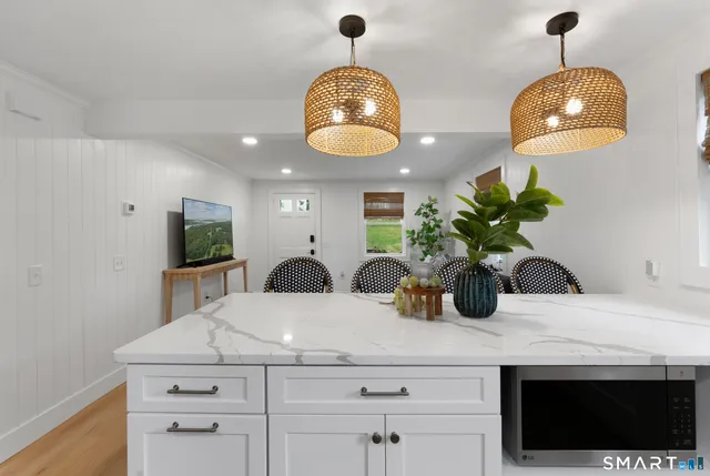 a kitchen with a sink and a chandelier