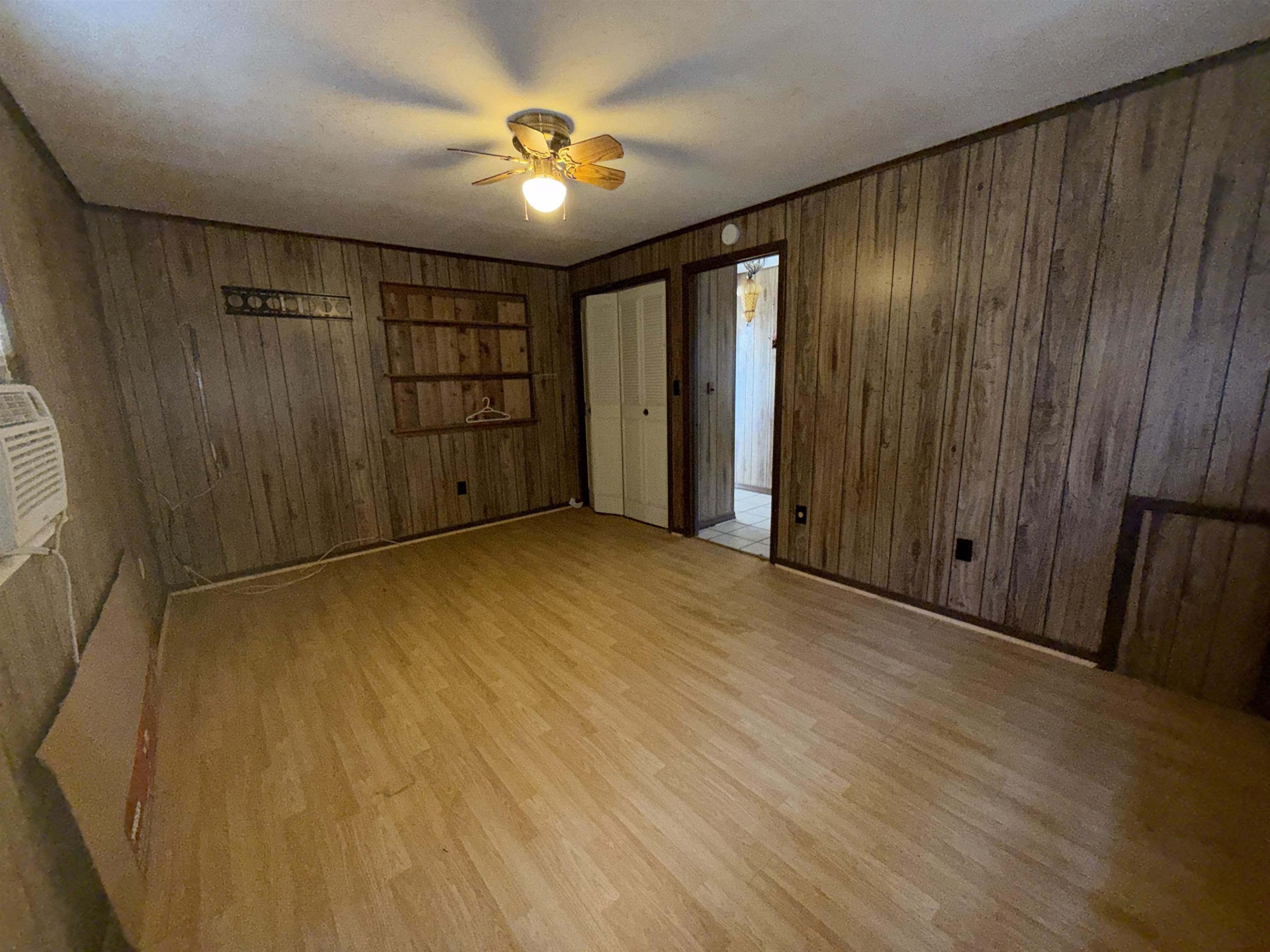 211 Cedar Creek Road Palatka, FL 32177 - Photo 13 of 24 a view of an empty room with wooden floor
