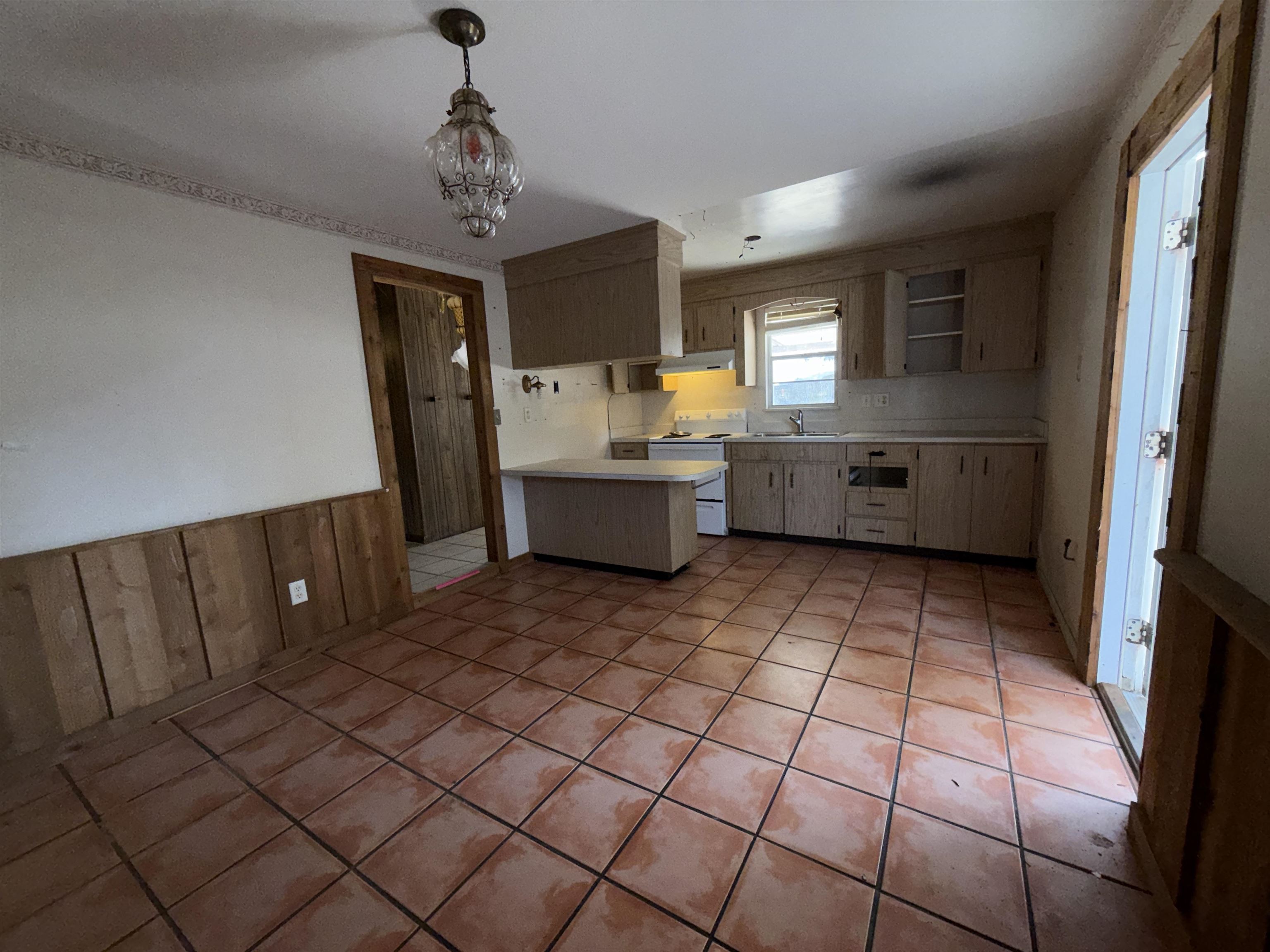 211 Cedar Creek Road Palatka, FL 32177 - Photo 16 of 24 a kitchen with a sink a counter top space and appliances