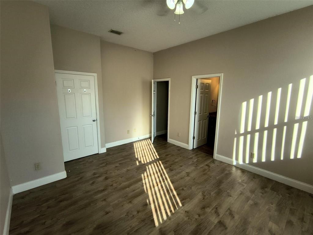 13 Wood Amber Lane, Unit B Palm Coast, FL 32164 - Photo 3 of 7 wooden floor in an empty room
