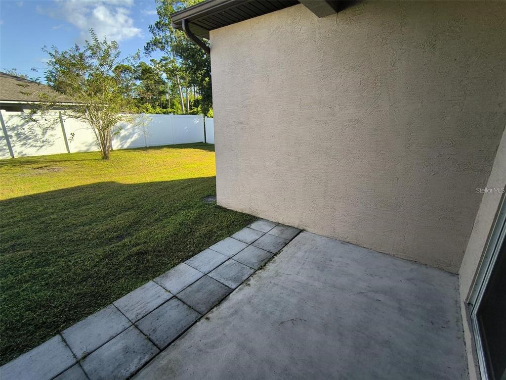 13 Wood Amber Lane, Unit B Palm Coast, FL 32164 - Photo 7 of 7 a view of an swimming pool and an outdoor space