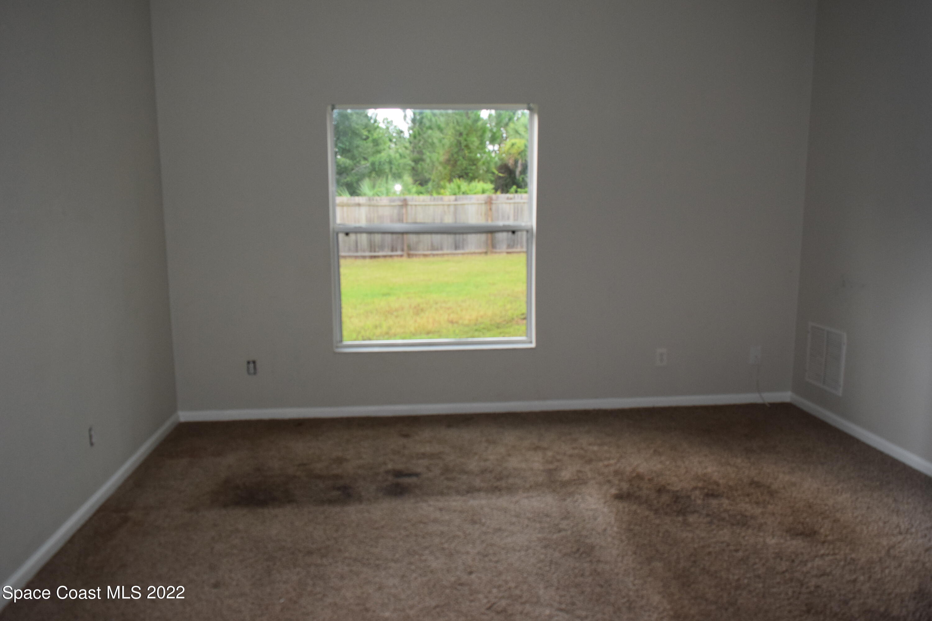 271 Titan Road Southeast Palm Bay, FL 32909 - Photo 15 of 22 an empty room with a window