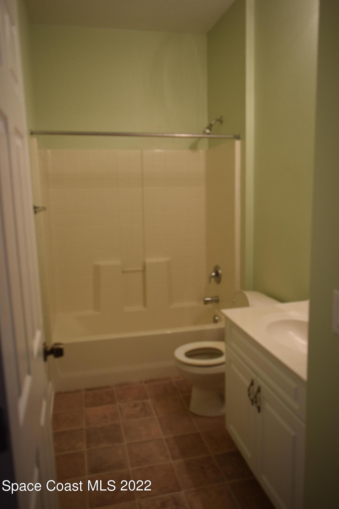 271 Titan Road Southeast Palm Bay, FL 32909 - Photo 17 of 22 a bathroom with a sink a toilet and shower