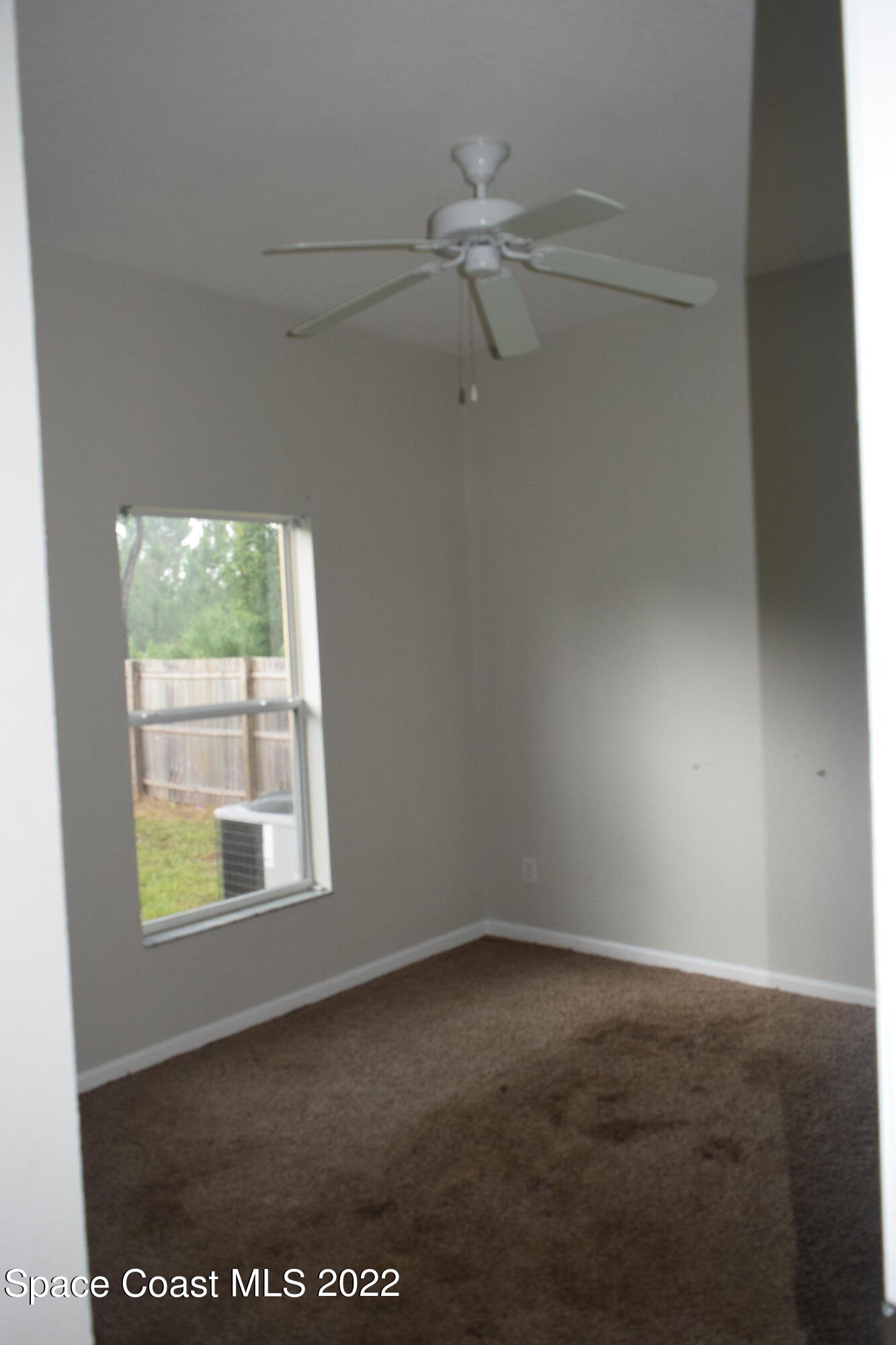 271 Titan Road Southeast Palm Bay, FL 32909 - Photo 18 of 22 an empty room with a window