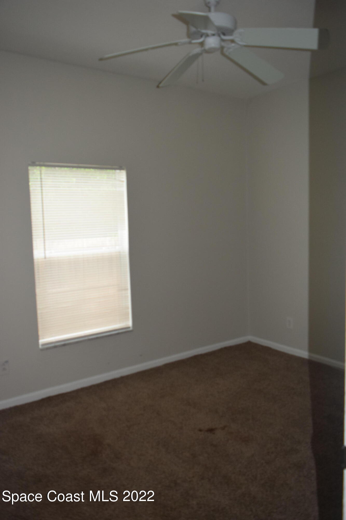 271 Titan Road Southeast Palm Bay, FL 32909 - Photo 19 of 22 an empty room with a window