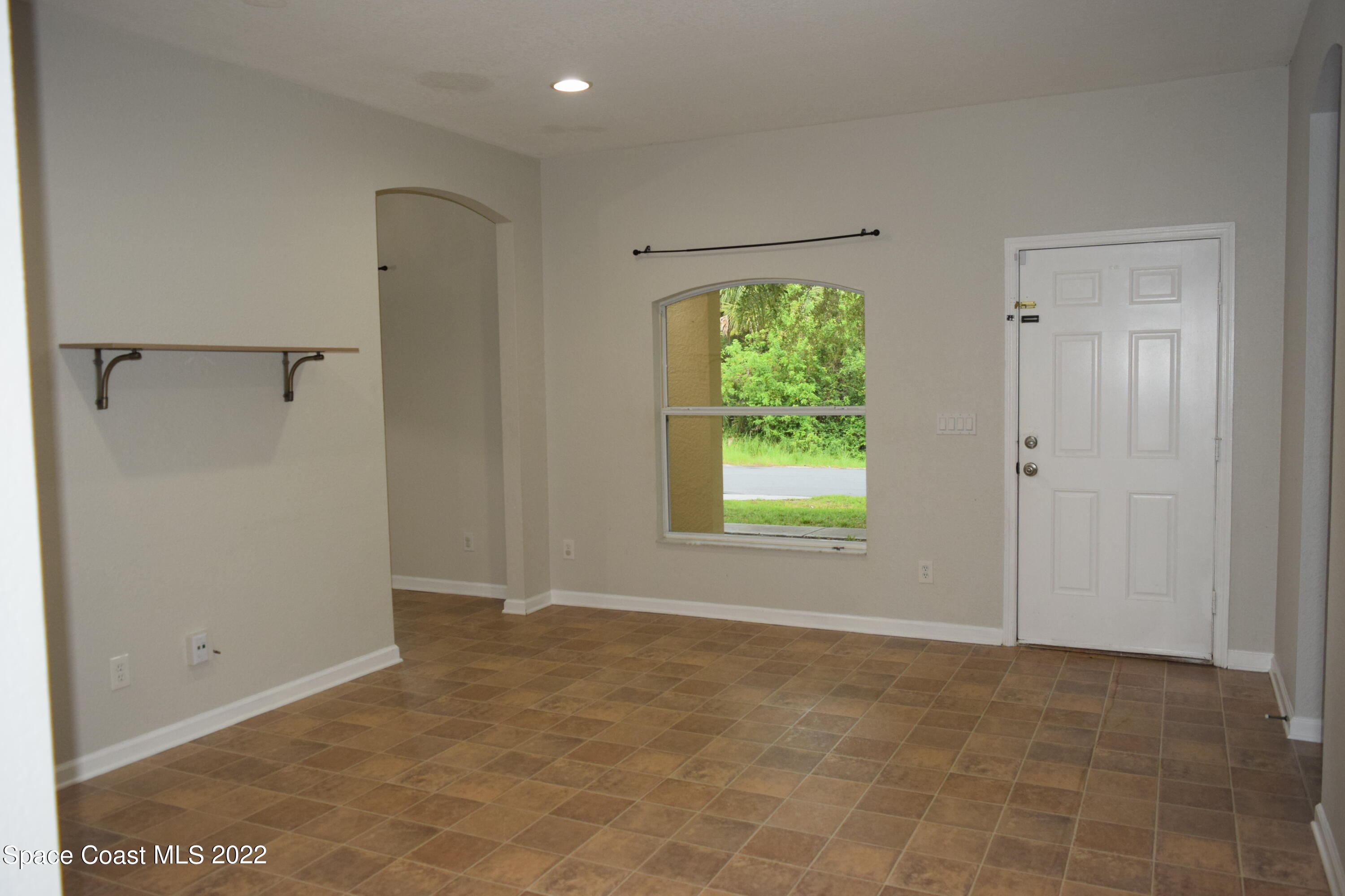 271 Titan Road Southeast Palm Bay, FL 32909 - Photo 2 of 22 a view of an empty room with a window