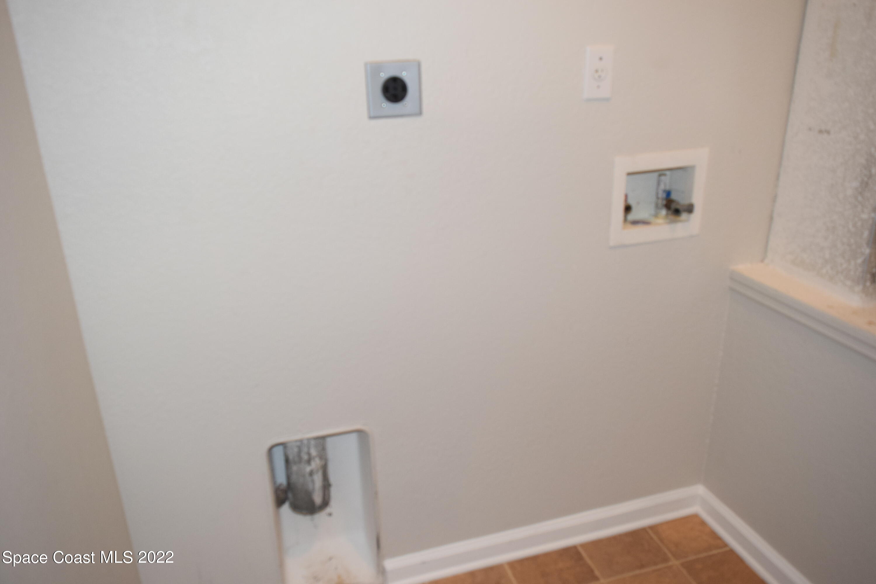 271 Titan Road Southeast Palm Bay, FL 32909 - Photo 22 of 22 a view of small space with closet